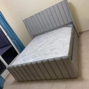 Elegant Grey Velvet Bed with Vertical Tufting