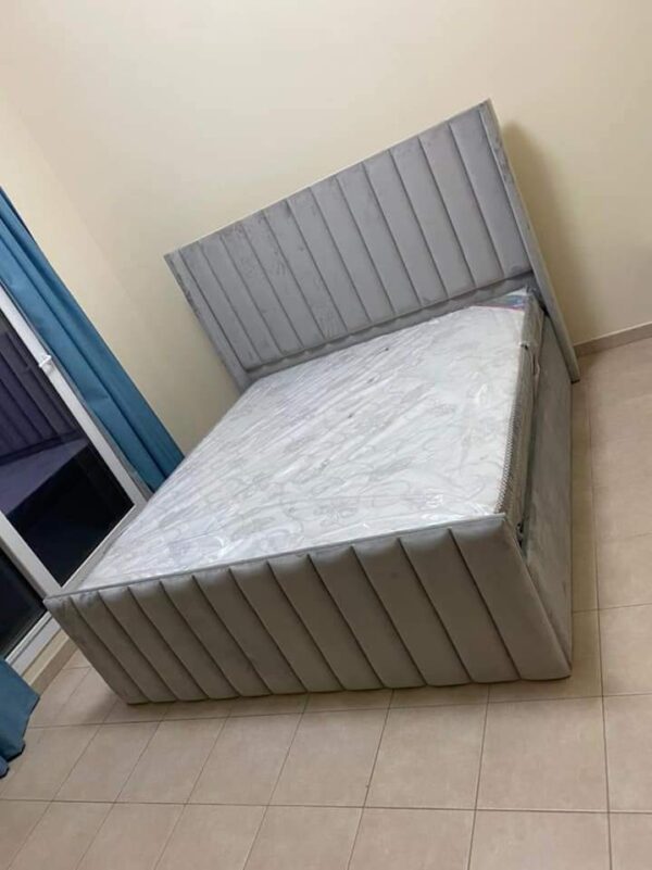 Elegant Grey Velvet Bed with Vertical Tufting